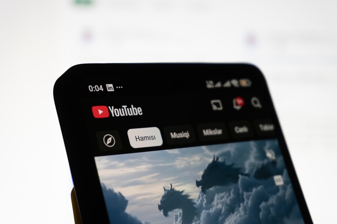smartphone-displaying-the-youtube-app-interface-f00cbjzuo1y